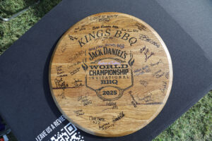 A wooden certificate showing King BBQ as winners of the 36th Jack Daniel's World Championship BBQ.